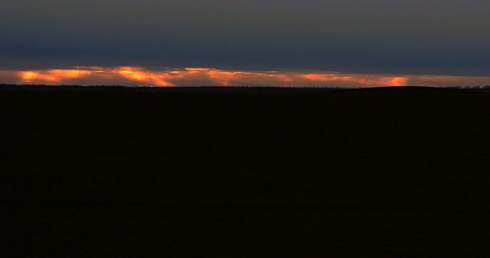 Распаханный курган на закате